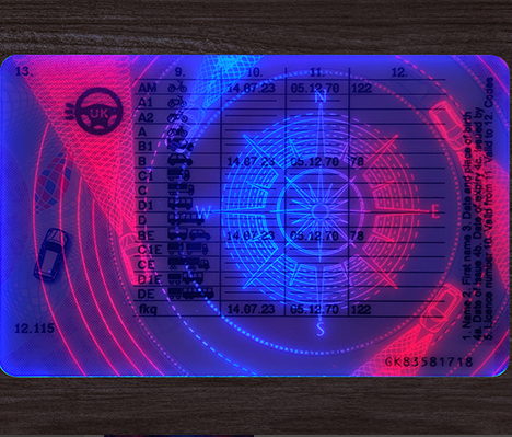 UV reactive security label with text and patterns on a dark surface